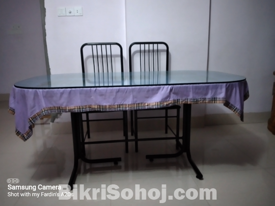 Otobi Four chair dinning table with only two chair